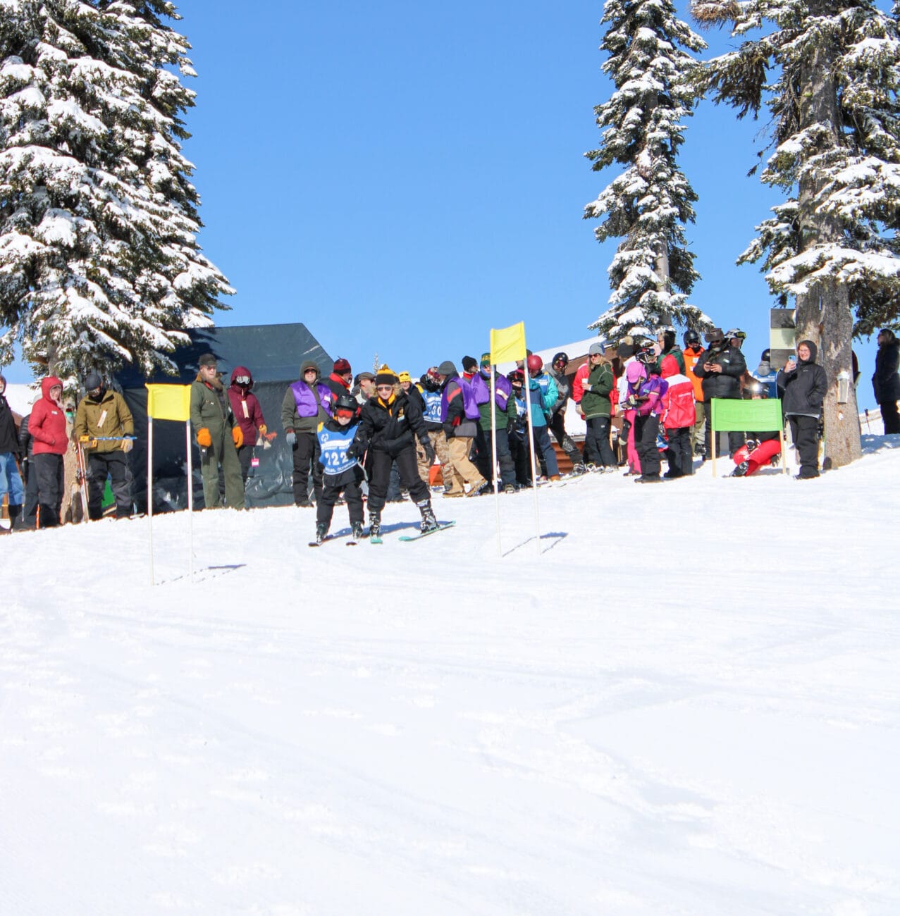 A group of people on skis participating in the Winter Special Olympics.