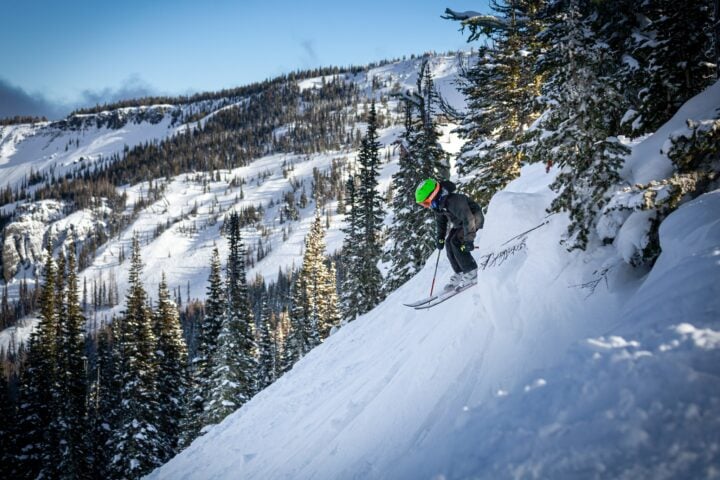 A person skiing down a Lost Trail slope.