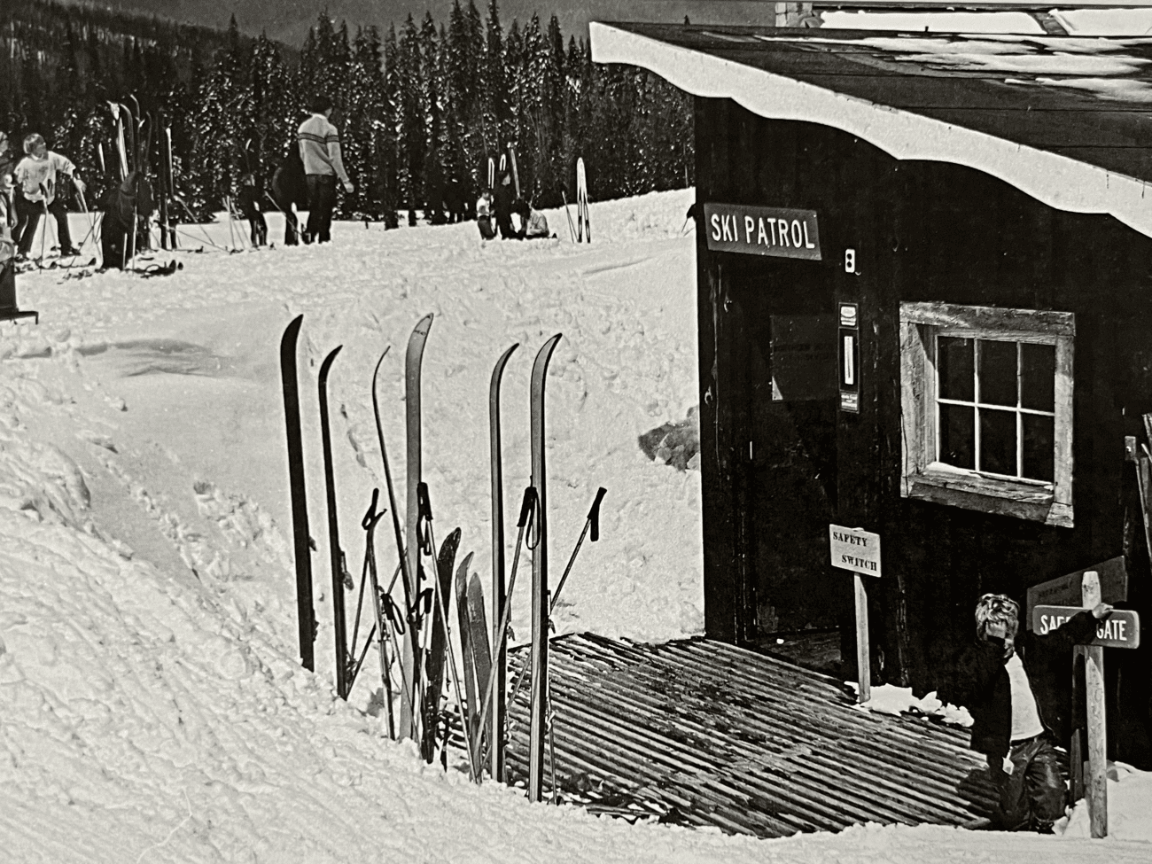 A black and white photo of Lost Trail Ski Area, a ski lodge.